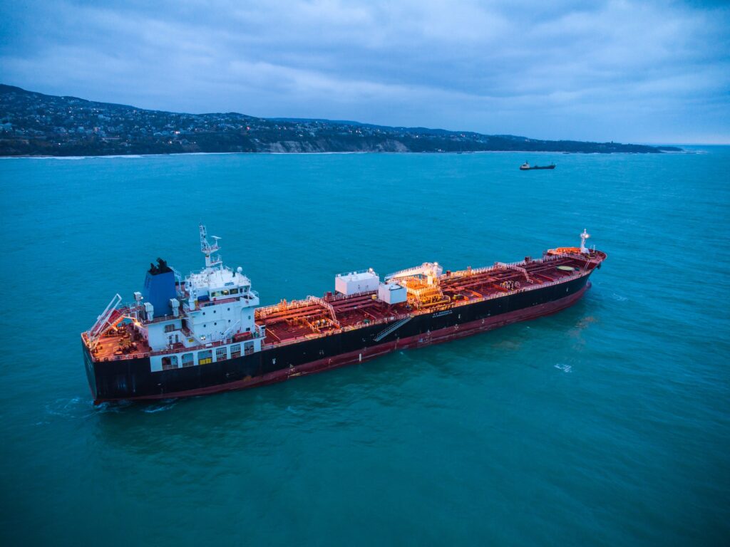 Aerial view oil ship tanker carrier oil on the sea at sunrise