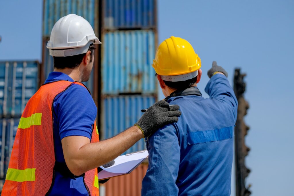 The back of engineer and technician help together for checking the quality of product